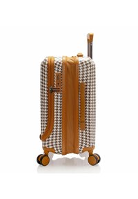 Valigia rigida con motivo a pied de poule in marrone e bianco, con accenti in pelle marrone, manico retrattile e base con quattro ruote.