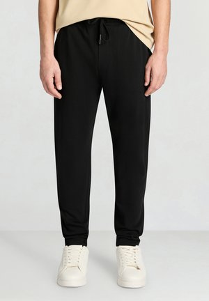 Calliope GINNICO LUNGO  UNITA - Pantaloni - nero ultrablack