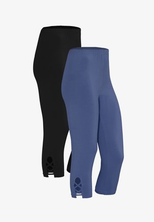 Sort og blå capri leggings lavet af elastisk stof. Egenskaber inkluderer en glat tekstur og krydsklipninger ved kanten.