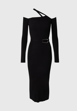 Black ribbed dress with one shoulder strap, long sleeve, and a side buckle detail. Made from stretchy material with a fitted silhouette.