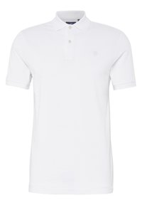 Vit polo skjorta i bomull, med klassisk krage, korta ärmar och placket med tre knappar. Minimal branding på bröstet.