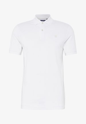 Bela polo majica iz bombaža, z klasičnim ovratnikom, kratkimi rokavi in tremi gumbi. Minimalno označevanje na prsih.