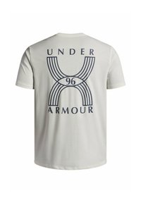 Short-sleeve, cream-colored t-shirt featuring a navy graphic design on the back, including the text "UNDER ARMOUR" and the number "96".