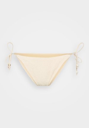 Crème-kleurige bikinionderkant gemaakt van textuurstof met verstelbare zijkanten en decoratieve kralen. Beschikt over een klassieke driehoekige vorm.