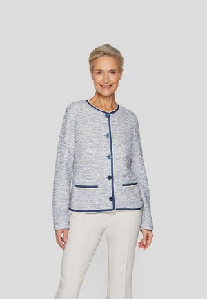 Blue and white textured jacket with round neckline, five buttons, and contrasting navy trim. Features two front pockets.