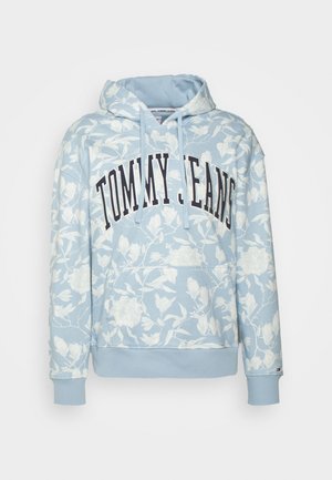 Light blue hooded sweatshirt with floral pattern, maroon "TOMMY JEANS" text across the front, ribbed cuffs and hem. Cotton blend material.
