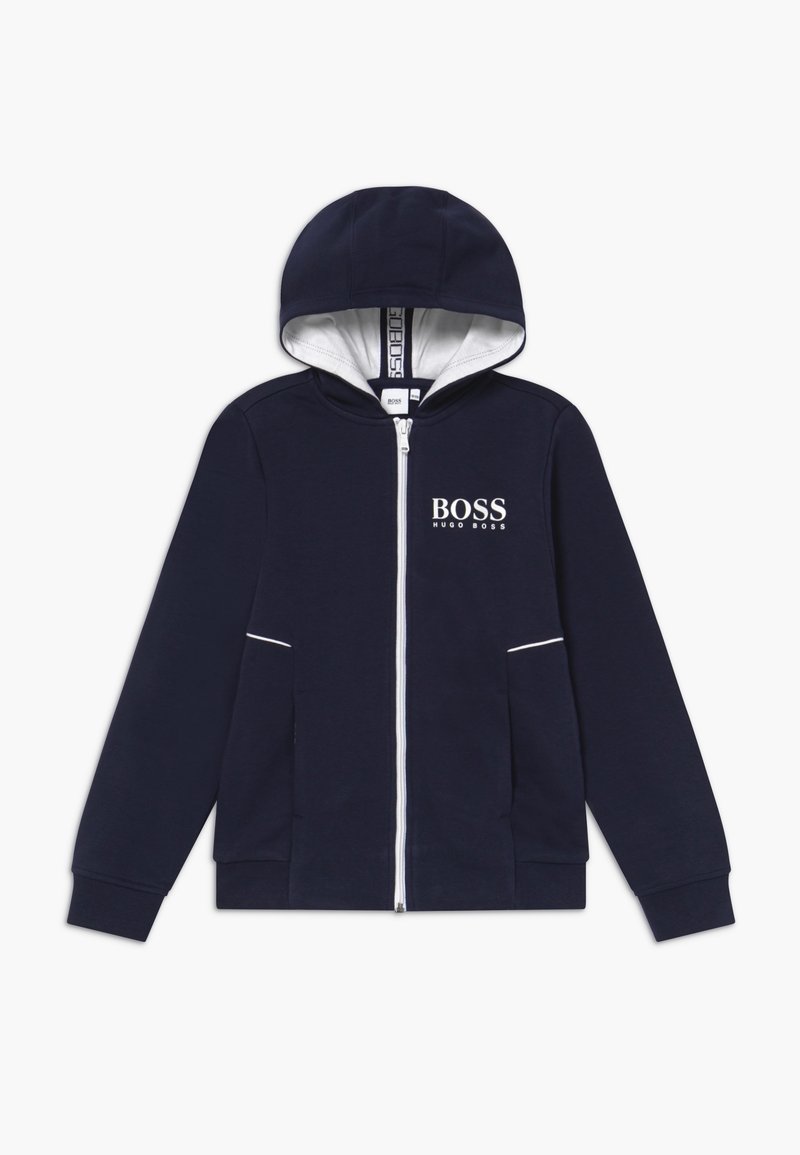 Navy blue zip-up collegepaita, jossa on valkoinen vuorihuppu, rintataskussa 'BOSS' logo, kaksi etutaskua ja valkoiset koristeompeleet saumoissa.