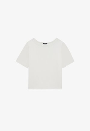 White short-sleeve top, made of smooth fabric, with a round neckline and a cropped design. Simple and minimalistic style with no additional details.