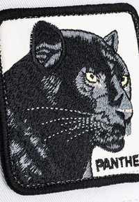 Embroidered patch featuring a black panther's head with yellow-green eyes, detailed whiskers, on a white background with "PANTHER" text.