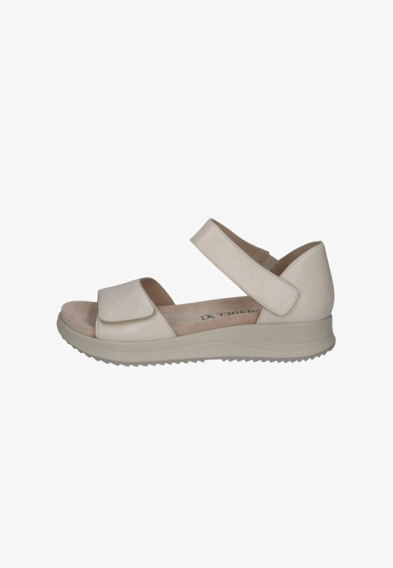 Sandales à plateforme beiges avec deux brides réglables en Velcro, dessus en cuir lisse et semelle extérieure texturée pour une meilleure adhérence. Idéales pour le confort.
