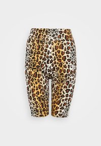 Cykelshorts med leopardtryck som har ett stretchy tyg, medelhög midja och en kombination av orange, svart och vitt.