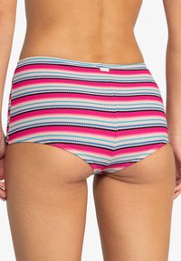 High-waisted swim bottoms with multicolored horizontal stripes in pink, blue, and black. Textured fabric with a seamless waistband detail.