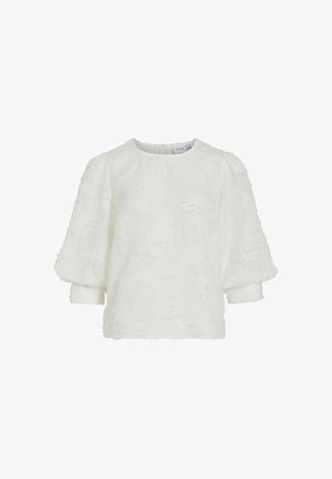 Top blanco texturizado con mangas de tres cuartos abullonadas y cuello redondo. Presenta un patrón de superficie suave y esponjosa y un cierre de cremallera en la parte posterior.