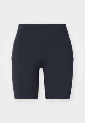 Högmidjade cykelshorts i marinblått tillverkade av mjuk, elastisk tyg. Har sidofickor och platta sömmar för ökad komfort och stöd.