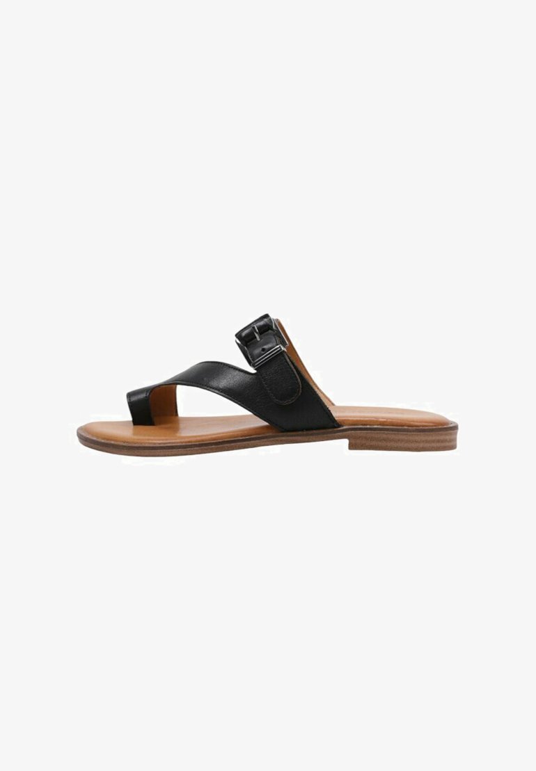 Black leather flat sandal with a buckle accent, a T-strap design, and a wooden sole. Smooth texture with a minimalist aesthetic.