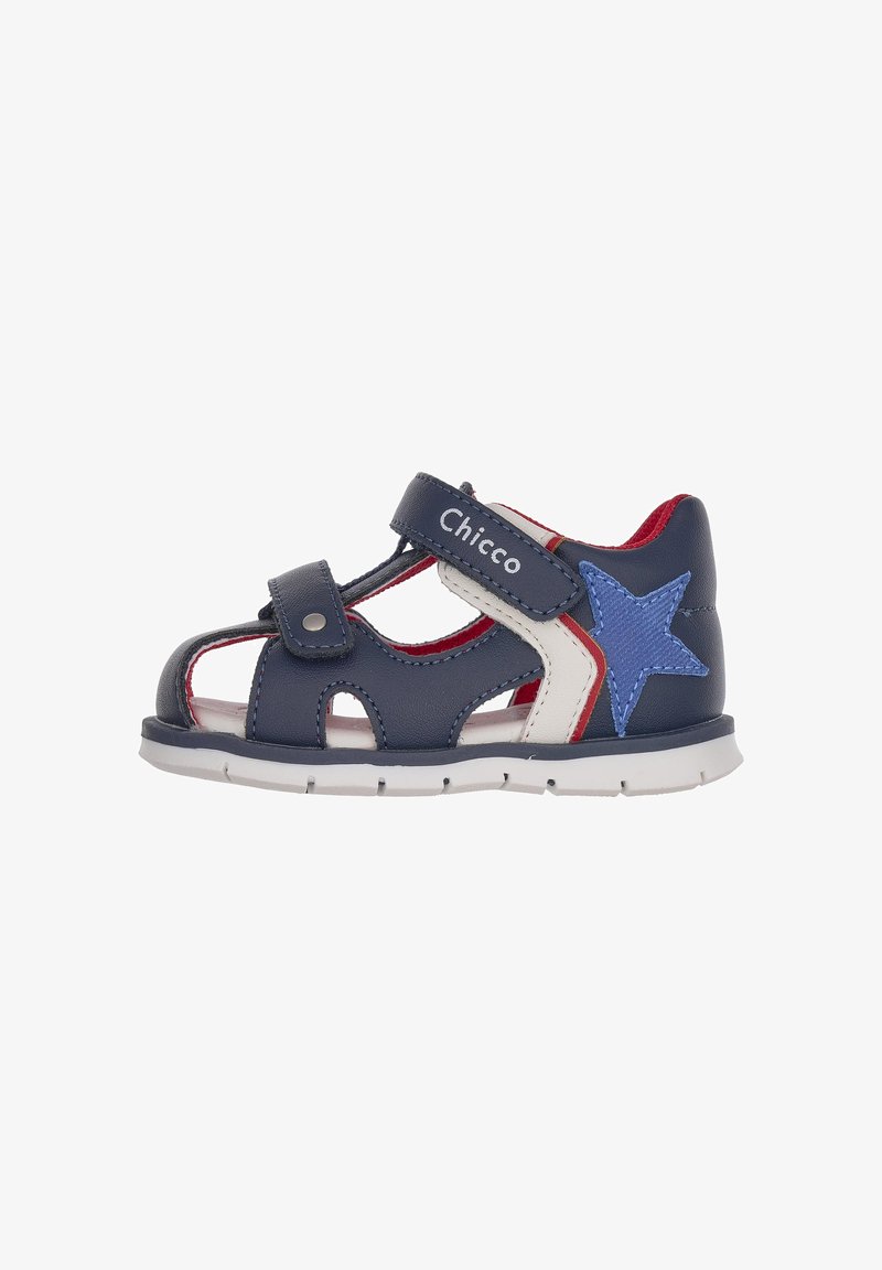 Navy leather sandal with a star accent, red interior, and white detailing. Features Velcro strap and cut-out design for breathability.