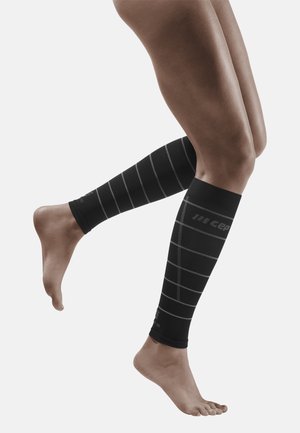 THE RUN COMPRESSION REFLECTIVE CALF SLEEVES WOMEN - MADE IN GERMANY  - Beenwarmer - black