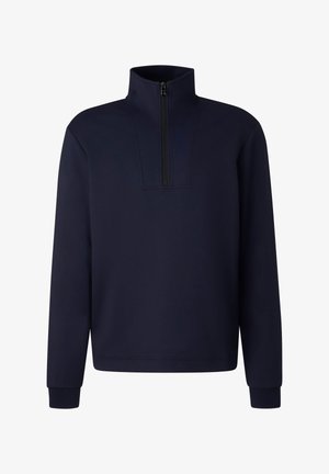 Granatowa bluza zapinana na zamek z długimi rękawami, usztywnionym kołnierzem i minimalistycznym wzornictwem. Wykonana z miękkiej, fakturowanej tkaniny.