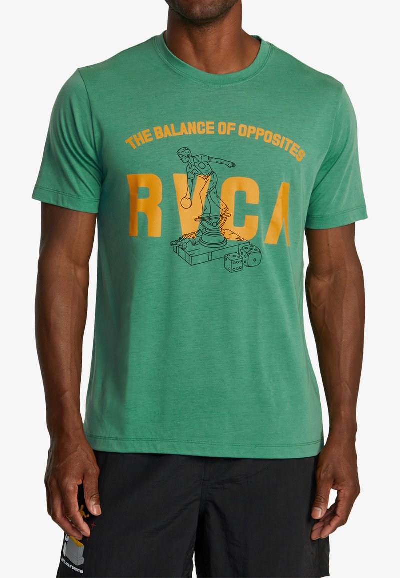 Green cotton t-shirt featuring a graphic print of a statue and the text "THE BALANCE OF OPPOSITES" and "RVCA" in yellow. Short sleeves.