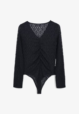 Body in pizzo nero con maniche lunghe, scollatura a V e dettagli arricciati sul davanti. Motivo in pizzo strutturato su tutta la superficie, forma aderente.