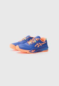 Blue athletic shoes with vibrant orange accents, textured mesh upper, and durable rubber sole. Features laces and logo on the side.