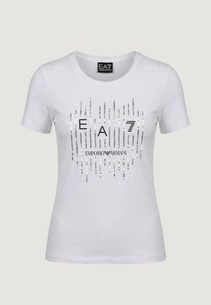 White short-sleeve t-shirt with "EA7 Emporio Armani" logo in black and silver vertical sequin stripes on the front.