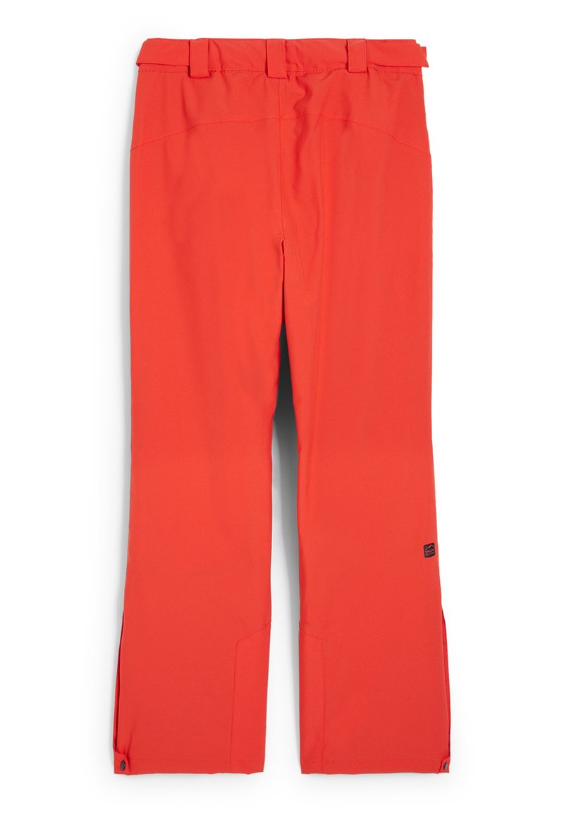 Rote Skihosen mit glatter Oberfläche, ausgestattet mit einem verstellbaren Bund, Seitentaschen und Reißverschlüssen an den Knöcheln für mehr Bewegungsfreiheit.