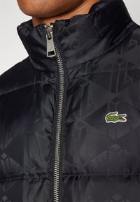 Lacoste Jakna ispunjena paperjem - black