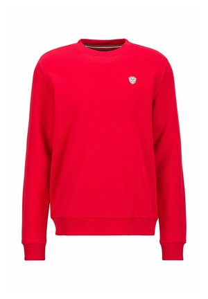 Roter Rundhalsausschnitt-Sweatshirt aus weichem Material. Mit langen Ärmeln und einem kleinen Emblem auf der Brust. Rippbündchen und Saum verleihen Textur.