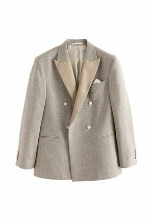 Light beige double-breasted blazer with wide satin lapels, four buttons, two pockets, and a pocket square, displayed on white background.