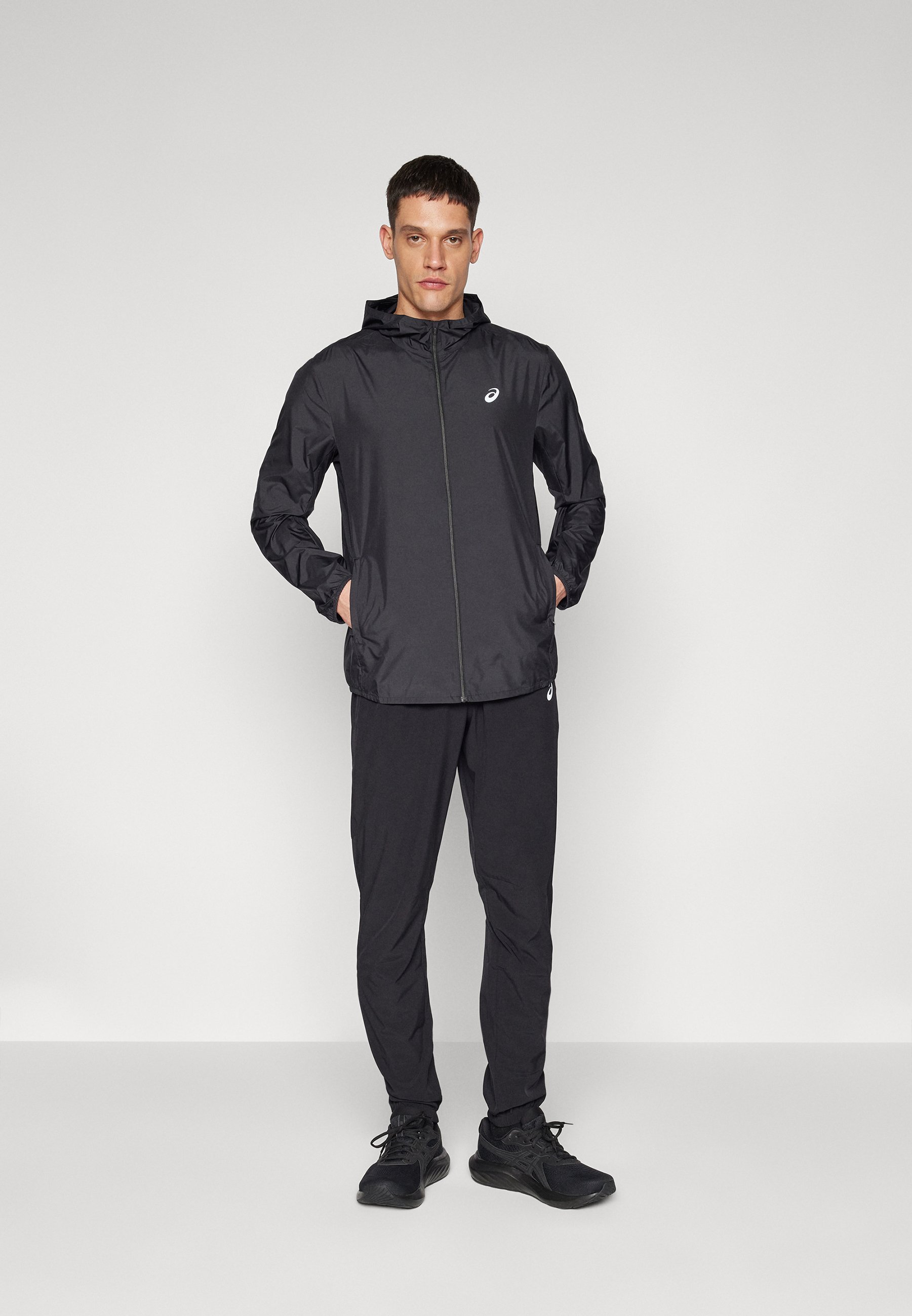 ASICS CORE - Tracksuit bottoms - performance black/black - Zalando.ie