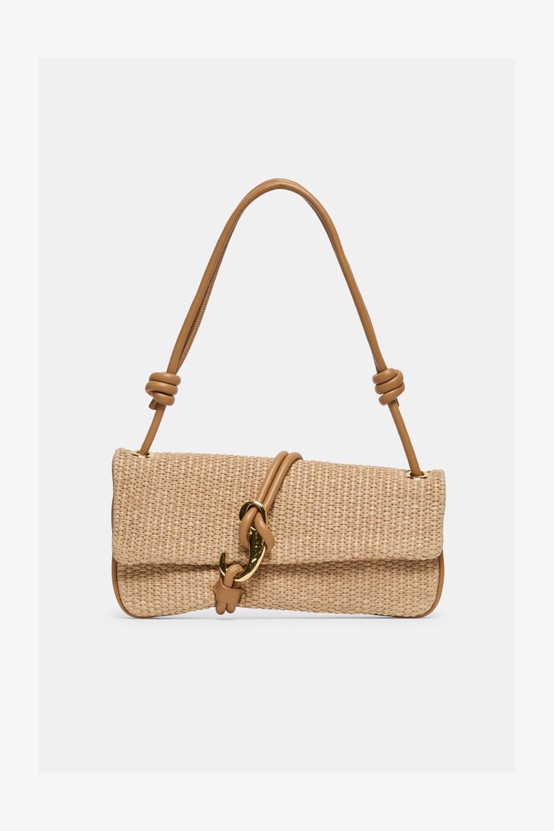 Rectangular woven beige handbag with tan leather strap featuring knots and a gold-tone hook clasp on a plain background.