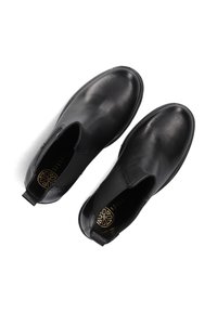 Stivali neri in pelle alla caviglia con pannelli laterali elasticizzati, punta rotonda e una soletta testurizzata con un design geometrico.