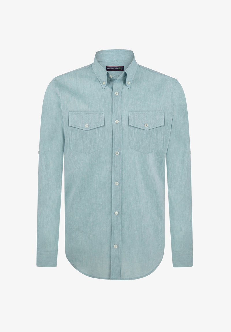 Heledane, pika-särgid, millel on pikad varrukad, on valmistatud tekstuurilisest kangast. Sellel on kaks rinna taskut ja ümar alläär. Nupud on kontrastse värviga.