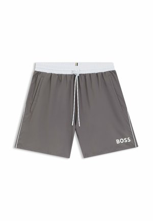 Grå badebukser med elastisk hvid talje, justerbar snøre, sidelommer og hvidt logo nederst til højre.