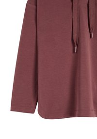 Maroon long-sleeve top made of soft fabric with a curved hem, featuring a drawstring neckline and minimal stitching details.