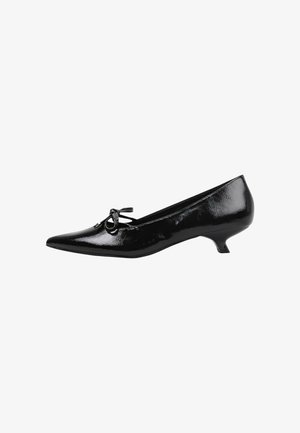 Black patent leather low-heeled shoe with pointed toe, featuring a small bow detail on the front and a textured surface.