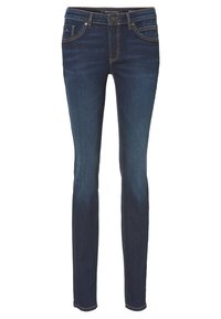 Jeans ajustados de denim azul oscuro, con un clásico diseño de cinco bolsillos, sutiles acentos de costura y una cremallera con cierre de botón.