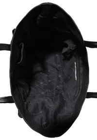 Black tote bag interior featuring a soft fabric lining, quilted pattern, a zippered pocket, and dual sturdy handles.