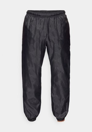Pantaloni neri, texturizzati, con vita elastica e polsini, che presentano un motivo geometrico su tutta la stoffa. Leggeri e dalla vestibilità ampia.