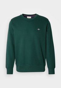 Sweat-shirt à col rond manches longues vert foncé avec poignets et ourlet côtelés, petit logo GANT brodé sur la poitrine gauche.