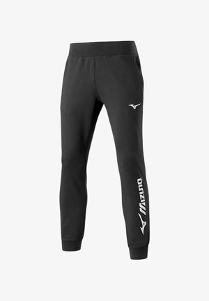 Pantaloni da jogging atletici neri con logo Mizuno bianco sulla parte superiore della coscia e nome del marchio lungo il polsino inferiore della gamba.
