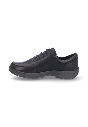 Zapato de cuero negro con bandas elásticas para un ajuste seguro, puntera redondeada, suela texturizada y un acabado suave en la parte superior.