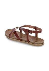 Brown leather sandals with crossed straps, adjustable buckle, and textured sole. Features a cushioned footbed and a minimalist design.