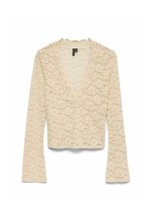 Beige kant lange mouwen top met een V-hals. Beschikt over een gestructureerd bloemenpatroon, een cropped lengte en zacht, delicaat materiaal.