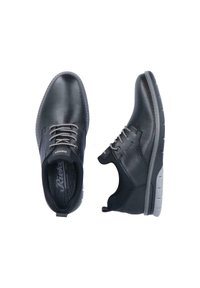 Black perforated leather shoes with lace-up design, padded collar, and a rubber sole. Features a subtle brand logo on the side.