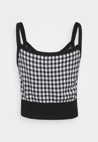 Černobílý crop top s houndstooth vzorem, s tenkými ramínky a kontrastním černým žebrovaným lemem. Vyrobeno z pletené tkaniny.