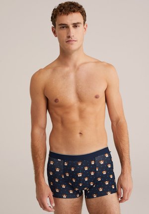 Marineblaue Boxershorts mit einem verspielten Hundemuster und dreieckigen Akzenten. Hergestellt aus weichem Stoff mit einem elastischen Bund für mehr Komfort.