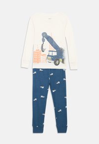 Katoenen pyjamaset met een crèmekleurige top met lange mouwen, voorzien van een grafische afbeelding van een blauwe kraan, en blauwe broek met een patroon van kleine witte vrachtwagens.