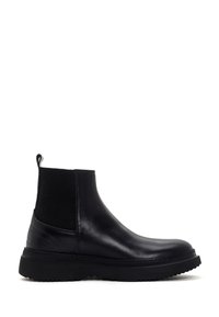 Bottine Chelsea en cuir noir avec semelle en caoutchouc épaisse, panneau latéral élastique et tirette à l'arrière, vue de côté droit.